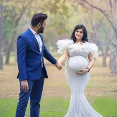 An elegant outdoor maternity portrait for an expecting couple. We chose a beautiful tree-lined path as the backdrop to capture their connection before they become parents.