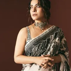 A closer look at the classic statement choker and the detailed blouse that complement this monochrome saree, styled for the 'Maa' movie promotions.