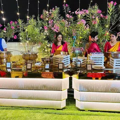 A beautiful buffet setup at my Sahakarnagar banquet hall. The combination of lush greenery and elegant, mirrored counters is perfect for a premium event.