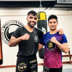 Learning from the best. Here I am with Professor Munish, a BJJ black belt, after an incredible seminar. I am always a student and believe in constantly learning to bring the best techniques to my students.