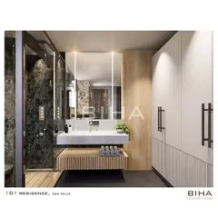 This angle reveals the thoughtful integration of storage and lighting. A full-height, minimalist white wardrobe provides ample storage, while vertical light strips framing the mirror offer perfect, shadow-free illumination for the vanity area.