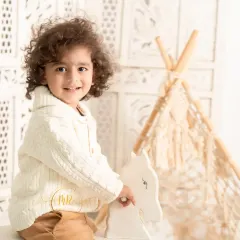 A classic toddler portrait with a rocking horse and a boho teepee. I have a wide range of props available in the studio to create fun and engaging sessions for kids.