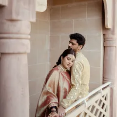An intimate and tender portrait of the couple. The bride rests her head on the groom's shoulder, a quiet moment of comfort and love captured beautifully.