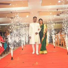 A spectacular entry for the couple on a red carpet, flanked by a series of cold pyro fireworks that create a grand and celebratory path.