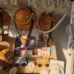 A closer view of the 'Baby Gupta' hamper, focusing on the charming details of the hot air balloons and the personalized banner.