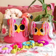 How much pink is too much pink? My answer is, never enough. Here are two of my Owlie Baskets, filled with toys and surrounded by colourful crochet flowers.