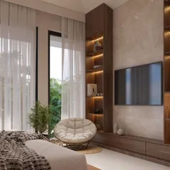 A view of the media wall and reading corner in the Japandi-style master bedroom. The built-in shelving with integrated lighting and the cozy papasan chair create a perfect nook for relaxation, blending form and function.