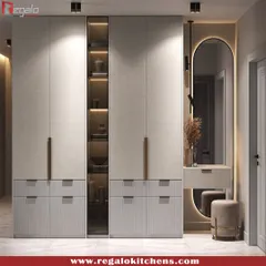 We create wardrobes that do more than just store clothes. This design seamlessly integrates a full vanity station with an illuminated mirror, providing a dedicated space for your morning routine without sacrificing style or storage.