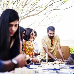 We bring the entire experience to you, whether it's your office or an off-site location. Our facilitators are there to guide the process, introduce challenges, and ensure everyone is engaged. Here you can see us helping a team get started on their collaborative build.
