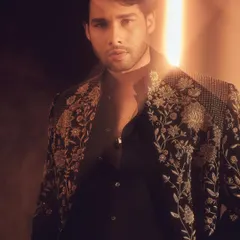 This close-up portrait of Siddhant shows the exquisite detail of the Tarun Tahiliani piece. It’s a masterclass in modern Indian craftsmanship.