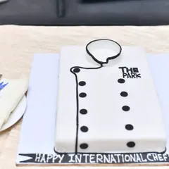 A special cake shaped like a chef's coat to celebrate my amazing culinary team on International Chef's Day.
