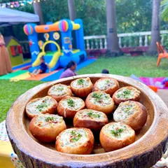 A close-up of my exotic veggie buns, filled with a creamy mixture and baked to perfection. They are a perfect warm appetizer for any outdoor event.