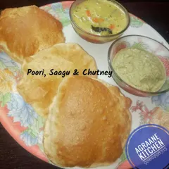 A weekend favorite for many, this plate of hot, puffy pooris is served with a delicious mixed vegetable saagu and a side of fresh coconut chutney. It's a comforting and hearty breakfast.