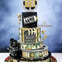It was an honor to design this special cake for Bollywood's "Mr. Perfectionist," Aamir Khan. This multi-tiered creation celebrates his cinematic journey with edible film reels, a movie clapperboard, and a glittering "60" topper for his milestone birthday.