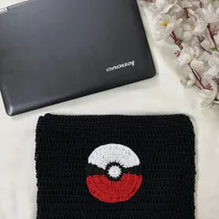 Another view of the Pokémon-themed crochet laptop sleeve, highlighting the detailed Poké Ball appliqué on the front.