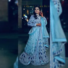 This is for the reception or sangeet night where you want all eyes on you. I designed this stunning ice blue lehenga with intricate, heavy embroidery that sparkles with every movement. It’s a true showstopper available for rent.