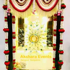 A beautiful floral decoration for a pooja room door. The intricate design uses jasmine, roses, and other traditional flowers to create an auspicious and welcoming entrance.
