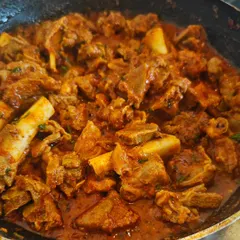 A close-up of my signature Kolhapuri Mutton. People think Kolhapuri food is just fiery red, but it's about a deep, enjoyable spice that comes from my Aai's special masala. This is the authentic taste I want you to experience.