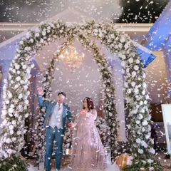 The pure joy of a grand entrance. We use techniques like confetti showers and dramatic lighting to capture the energy and excitement of your reception, making for unforgettable, dynamic photographs.