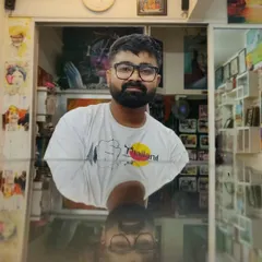 A self-portrait in my creative space. My art is an extension of who I am, and I pour my passion and dedication into every tattoo I create.