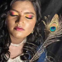 Another angle of the Haldi look, showing the beautiful blend of orange, yellow, and pink on the eyes.