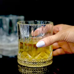 This version of my whiskey glass features a simpler, yet equally elegant, patterned gold base. It is a timeless design for enjoying a fine pour at the end of the day.