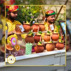 We love incorporating traditional elements into our bar design. This setup features drinks served in authentic kulhads and matkas, perfect for a rustic or Rajasthani-themed wedding.