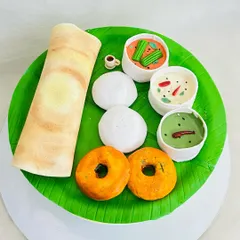 Another angle of the South Indian breakfast cake, showing the realistic texture of the dosa and the details in the chutneys. I love creating cakes that surprise and delight people.