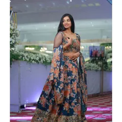 This floral print lehenga is a beautiful blend of traditional and modern styles. The lightweight fabric and elegant design make it a great choice for a daytime wedding event or a pre-wedding shoot.