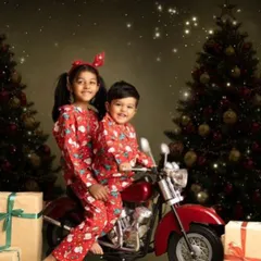 A fun and unique Christmas shot with siblings in matching pajamas on a miniature motorcycle. I love incorporating creative props to make holiday photos extra special.