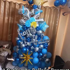 This is an example of my 8-foot jumbo balloon bouquets, perfect for making a big statement. This one, for a 32nd birthday, uses a stylish blue and silver chrome theme with a large crown foil balloon.