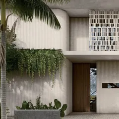 A close-up view of the material palette for our pavilion homes, showing the interplay of textured walls, hanging greenery, and intricately patterned screens. These elements work together to create a facade that is both visually rich and passively cooled.