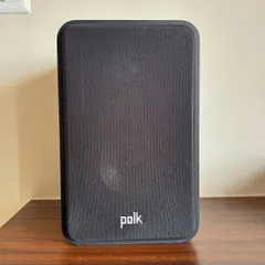 A close-up of the Polk Audio Signature Elite ES15 bookshelf speaker. It's a compact, high-performance speaker that delivers impressive clarity and depth, making it great for both music and home theater setups.
