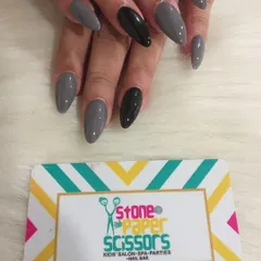 A cool and modern color combination of slate grey and black. The single black accent nail adds a point of interest to this otherwise simple and chic manicure.