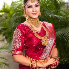 This full-length portrait showcases the bride's complete look, from the elegant saree drape to the flawless makeup. The goal was to create a look that felt both traditional and modern.