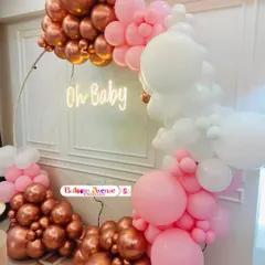 A detailed shot of the rose gold and pink balloon arrangement, showing the mix of metallic and pastel colors.