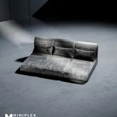 The same lounge sofa design shown in a versatile grey fabric. This demonstrates our ability to customize upholstery to match any interior design scheme.