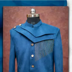 A modern and stylish blue Jodhpuri suit with unique layered lapels and subtle embroidery. A great choice for a reception or sangeet.