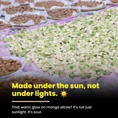 Our pickles are made under the sun, not under artificial lights. That warm glow on the mango slices isn't just sunlight; it's the soul of our traditional process, which allows the flavours to mature naturally.