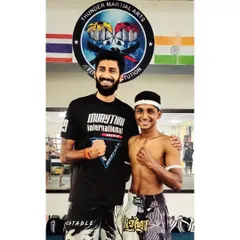 As a Kru, my role is to guide you. Here I am with one of my students after his successful grading, ready for the next level in his Muay Thai journey.