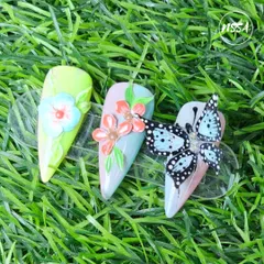 A showcase of dimensional art, combining 2D painted flowers with a fully sculpted 5D butterfly. This piece highlights the different effects you can achieve by layering techniques with our gel polishes.