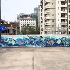 This is a massive graffiti mural I painted for a pickleball court. The entire wall is filled with dynamic, abstract shapes and characters related to the sport.