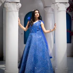 This look for a designer gown shoot shows how makeup completes the entire vision. I created a soft glam look with a smokey blue-toned eye to match the royal blue dress, ensuring the model looked elegant and the makeup photographed beautifully in natural outdoor light.