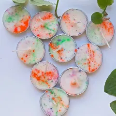 Another look at the Holi tealights, arranged in a heart shape. Each pack of ten is hand-poured with love and a festive spirit.