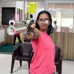 A young shooter holds her stance, demonstrating the focus and discipline that the sport instills. This is a preview of the professional air pistol training we provide as our students prepare for state-level competitions.