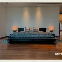 Your bedroom should be a retreat. We designed this low-profile platform bed and integrated headboard to create a serene, uncluttered space with a touch of hotel luxury.