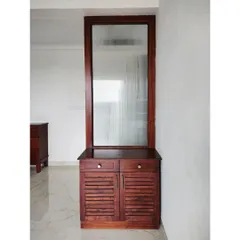 This versatile shoe rack doubles as an entryway partition. It features slatted doors for ventilation, drawers for small items, and a fluted glass panel on top for privacy and style.