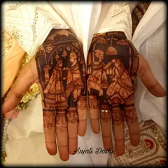 I love when grooms want to tell their story. This detailed portrait mehendi shows the varmala ceremony, creating a beautiful and personal piece of art for the groom's hands. The dark stain makes the figures pop.