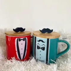 A perfect gift for the dapper gentleman in your life. Our "Elegant Man" mugs come in red and teal, each featuring a tuxedo design and a wooden lid with a fun mustache handle.