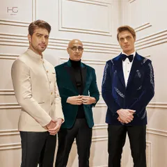Here, I've styled three distinct looks for the wedding season, demonstrating the range of my work. From a classic ivory bandhgala to rich velvets and an embroidered tuxedo, each piece is crafted for royal luxury.